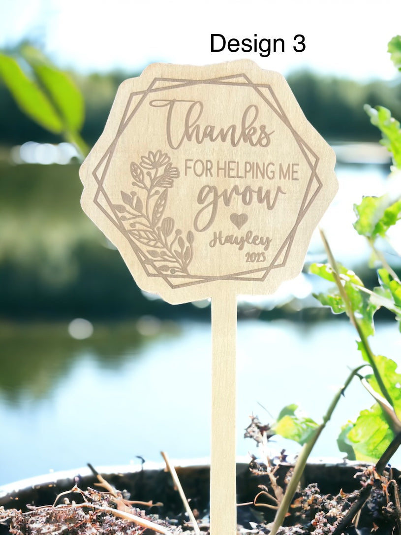 Teachers plant stakes - 4 Little Dreamers