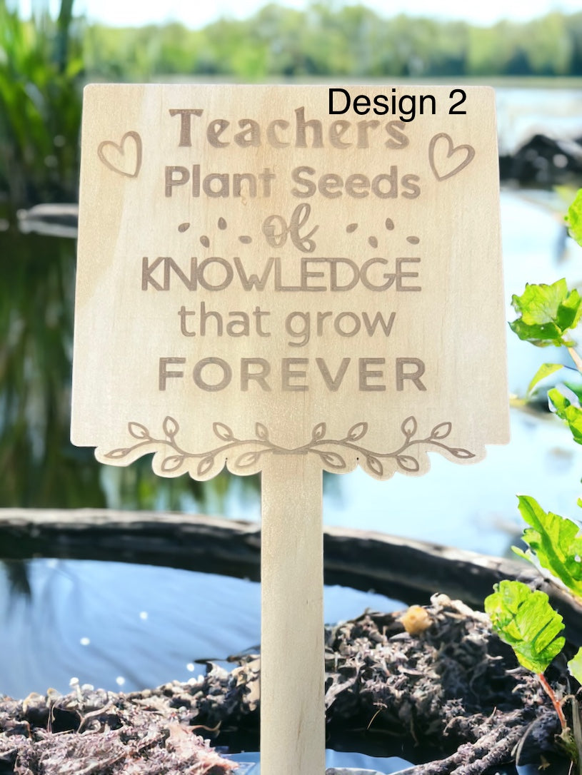 Teachers plant stakes - 4 Little Dreamers